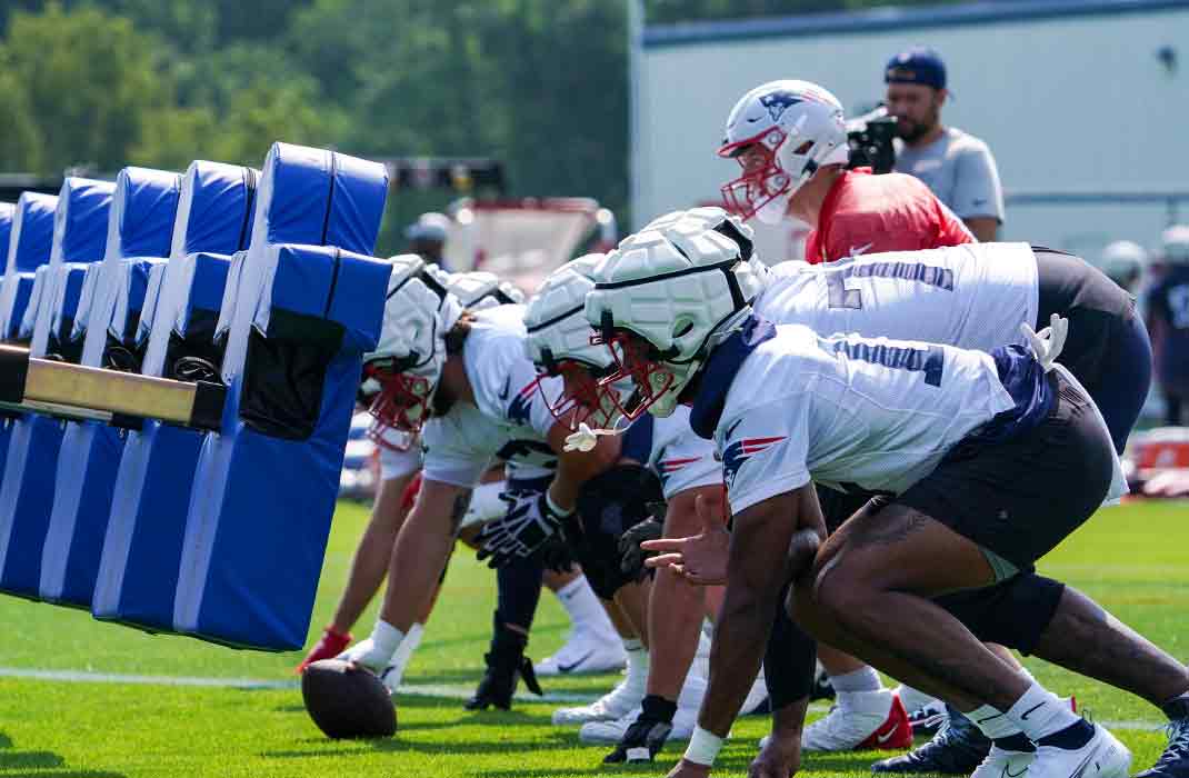 American football players practicing at training camp