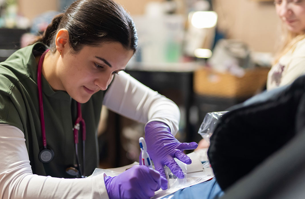 female provider with patient writing down notes