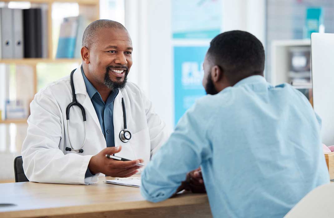 A young man with his doctor