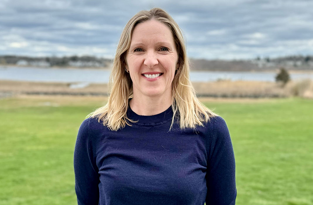 Ann Malik standing outside