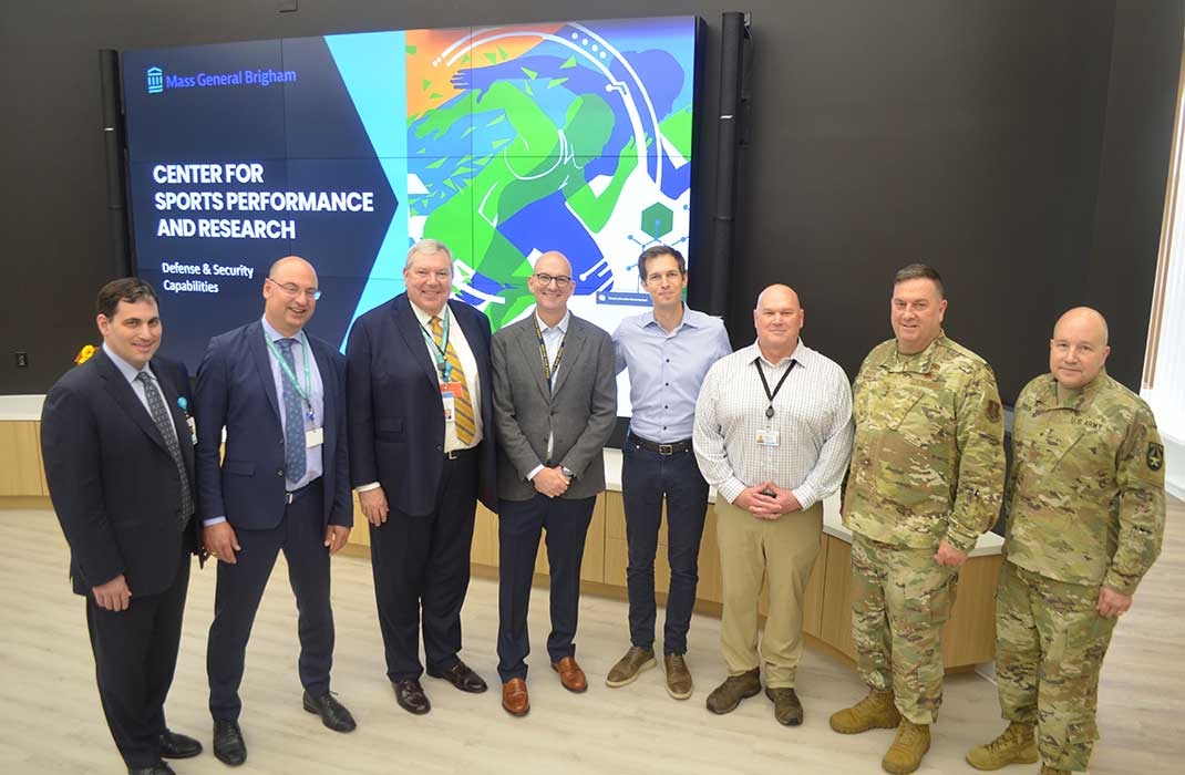 Congressman Auchincloss standing with first responders and members of the Center for Sports Performance and Research