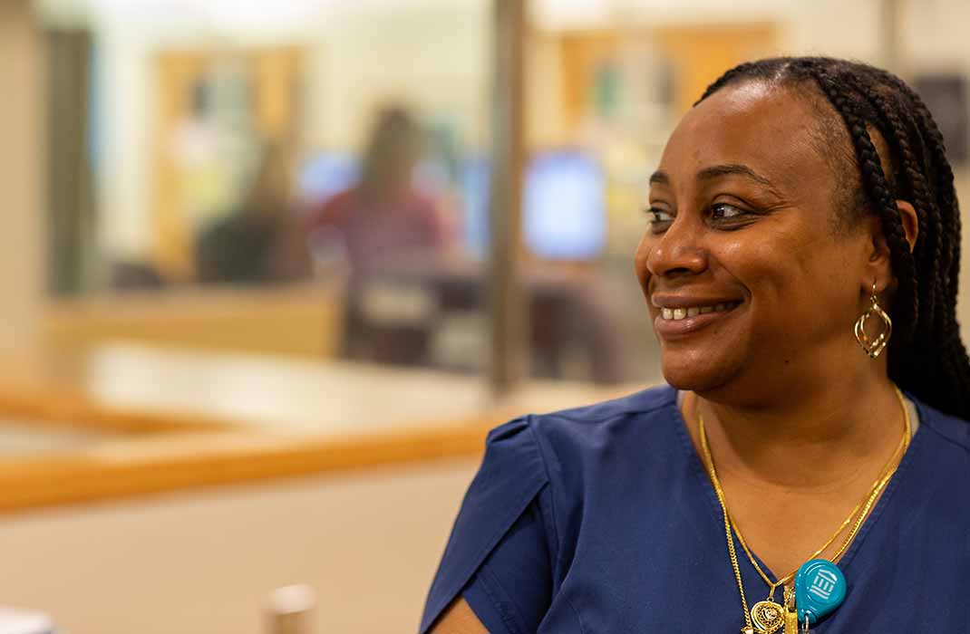 Healthcare worker looking to the side with a smile