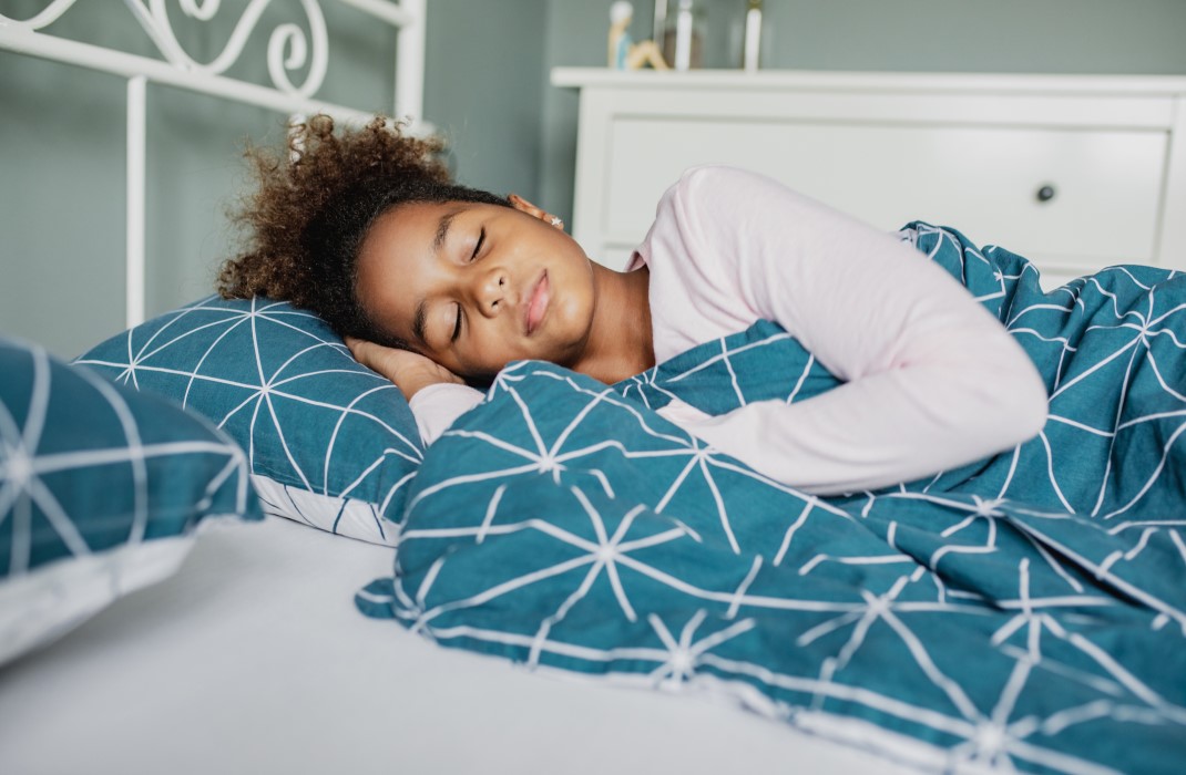 Girl sleeping on a bed