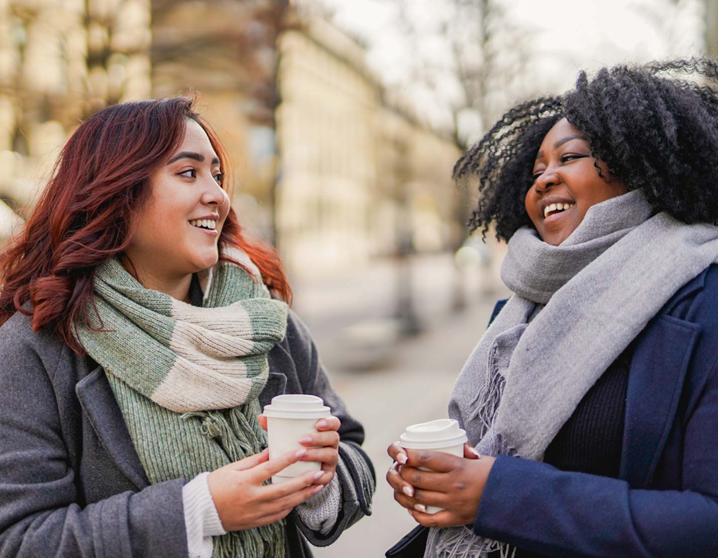 Two women enjoying coffee outdoors