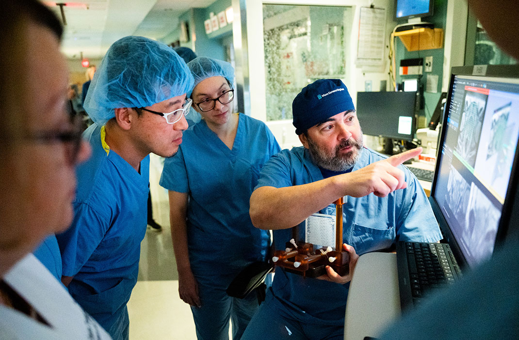 Four providers look at results on a screen