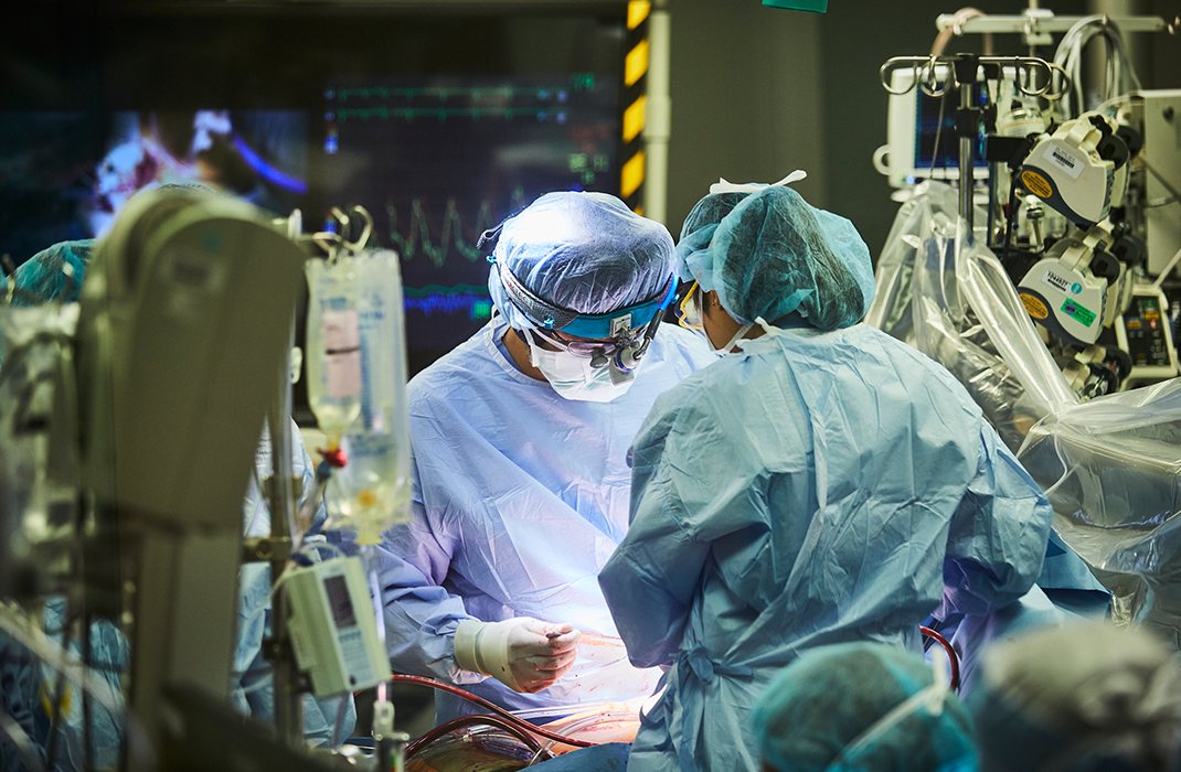 surgeons performing surgery in operating room