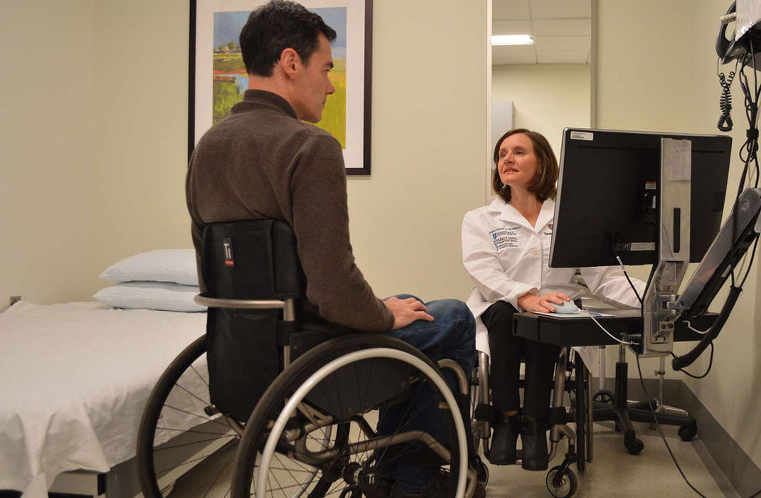 Cheri Blauwet, MD with a patient