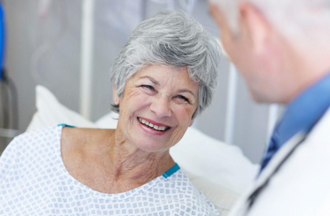 older female patient talking with provider