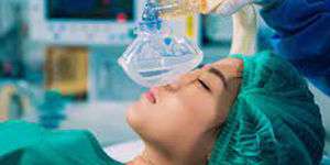 woman in operating room about have oxygen mask placed on her
