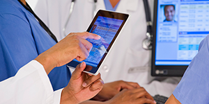 doctor using tablet to view patient information