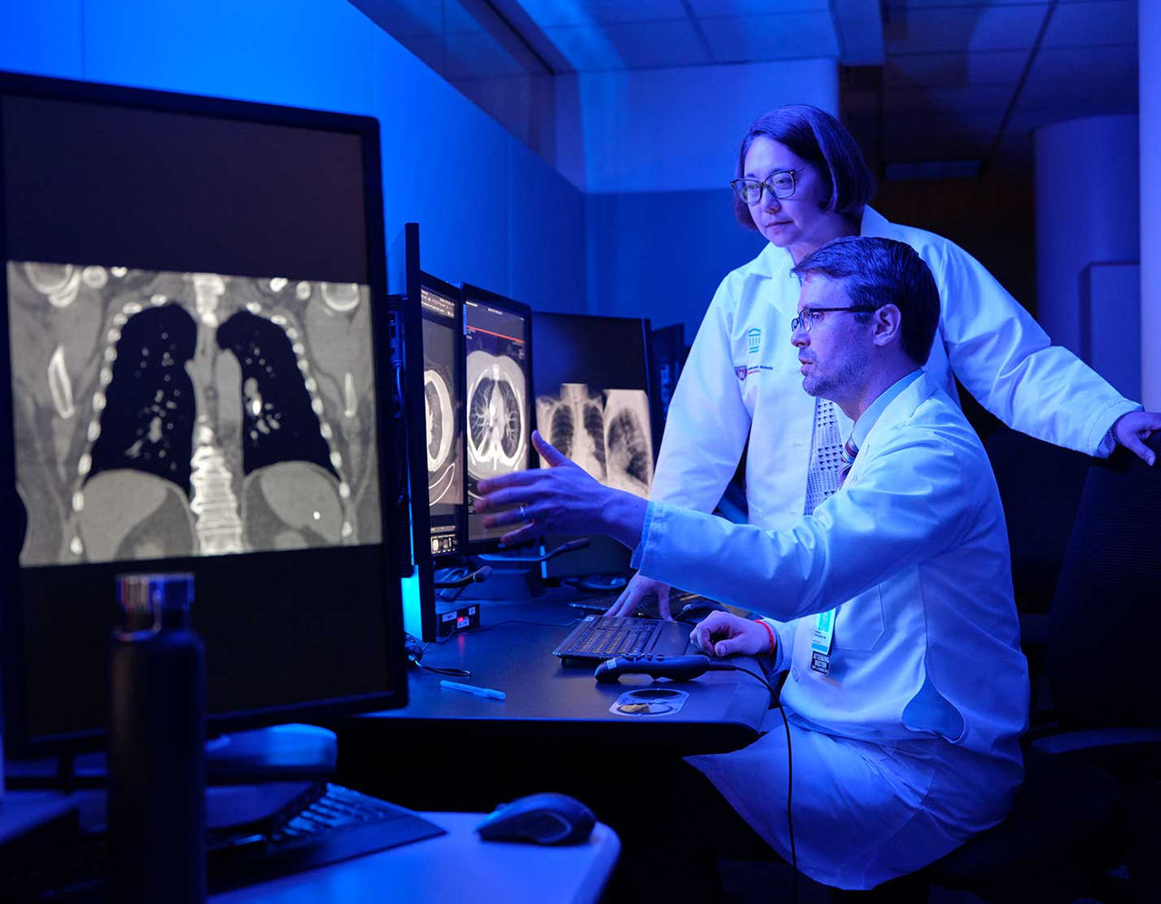 cancer providers reviewing medical scans in lab