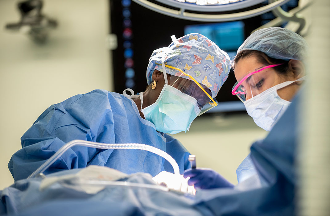 two female doctors during surgery in operating room