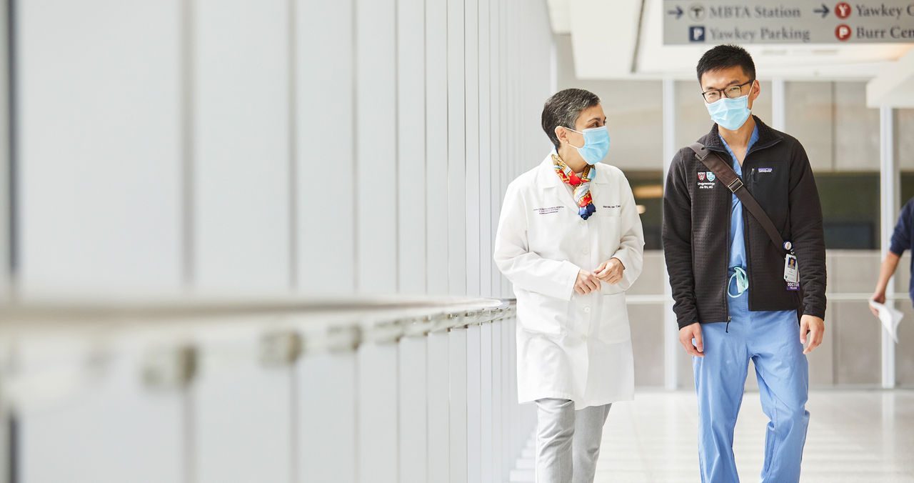 clinicians chatting in hallway