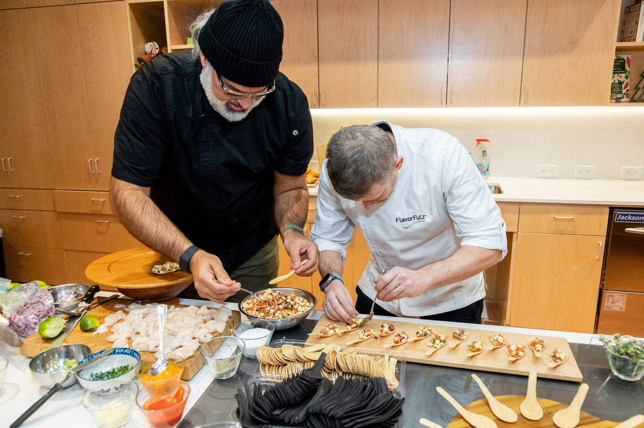 Two chefs plate hors d'oeuvres at a new teaching kitchen.