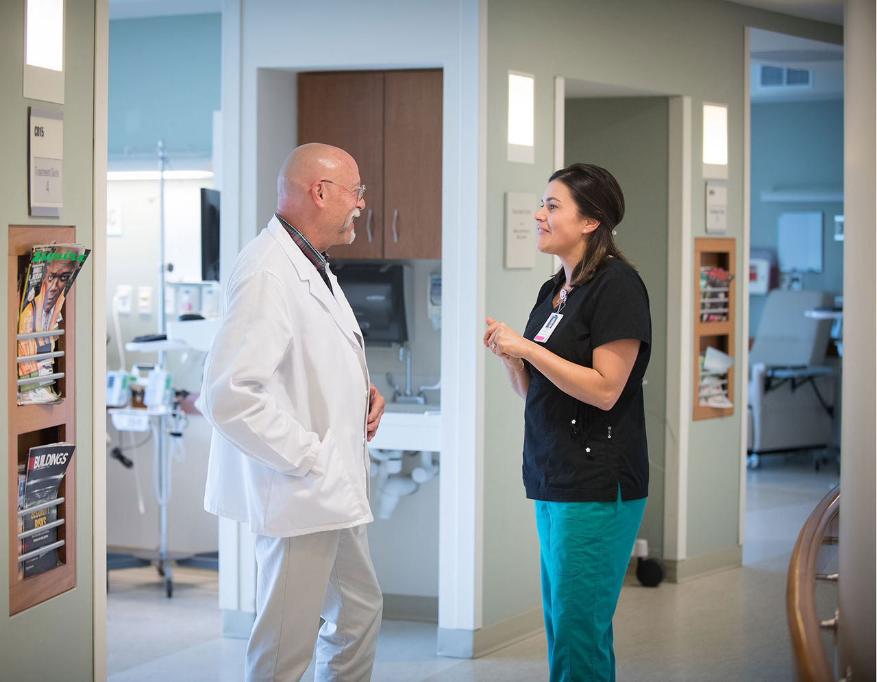 doctor talking with nurse