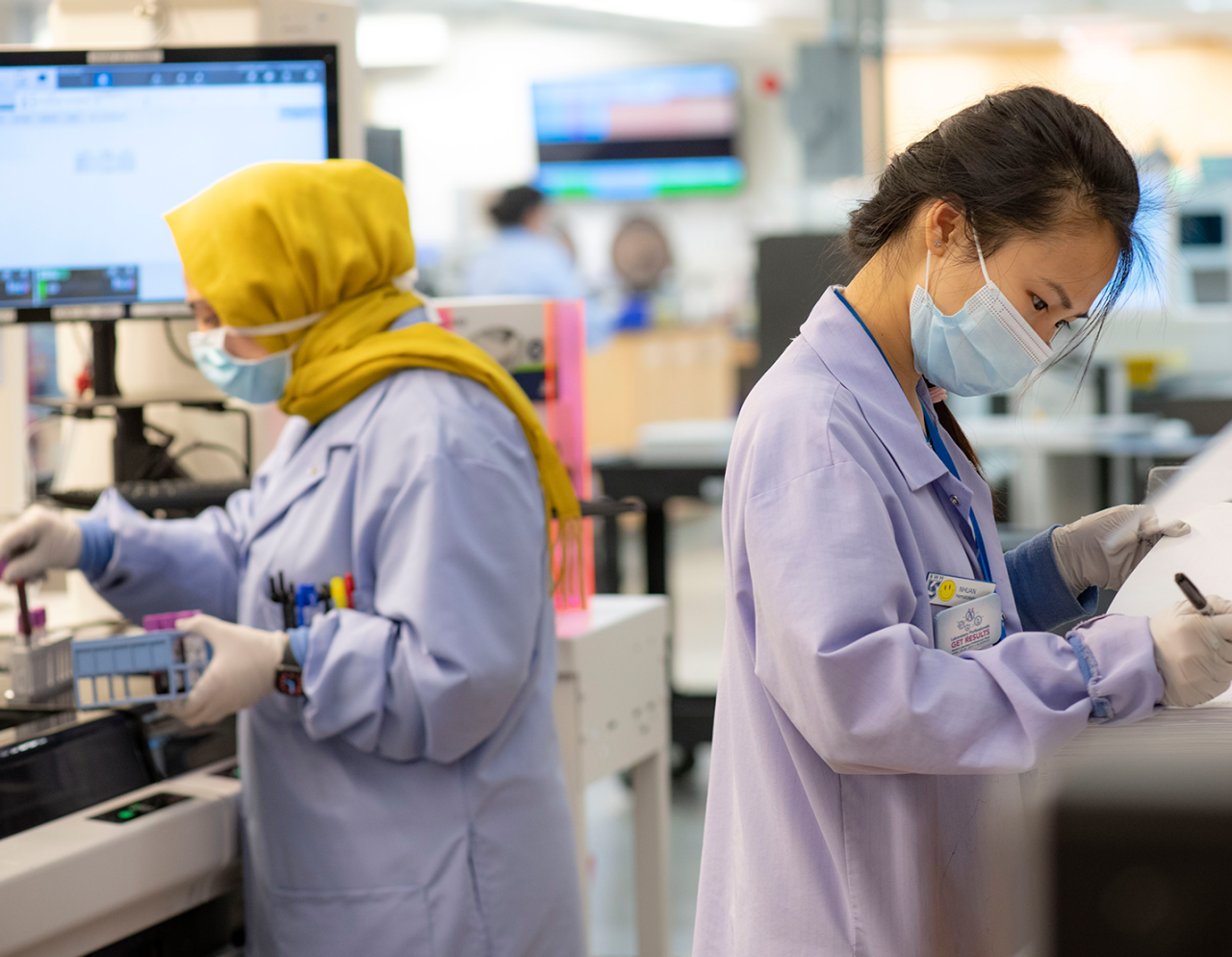 Two female researchers in a lab setting 