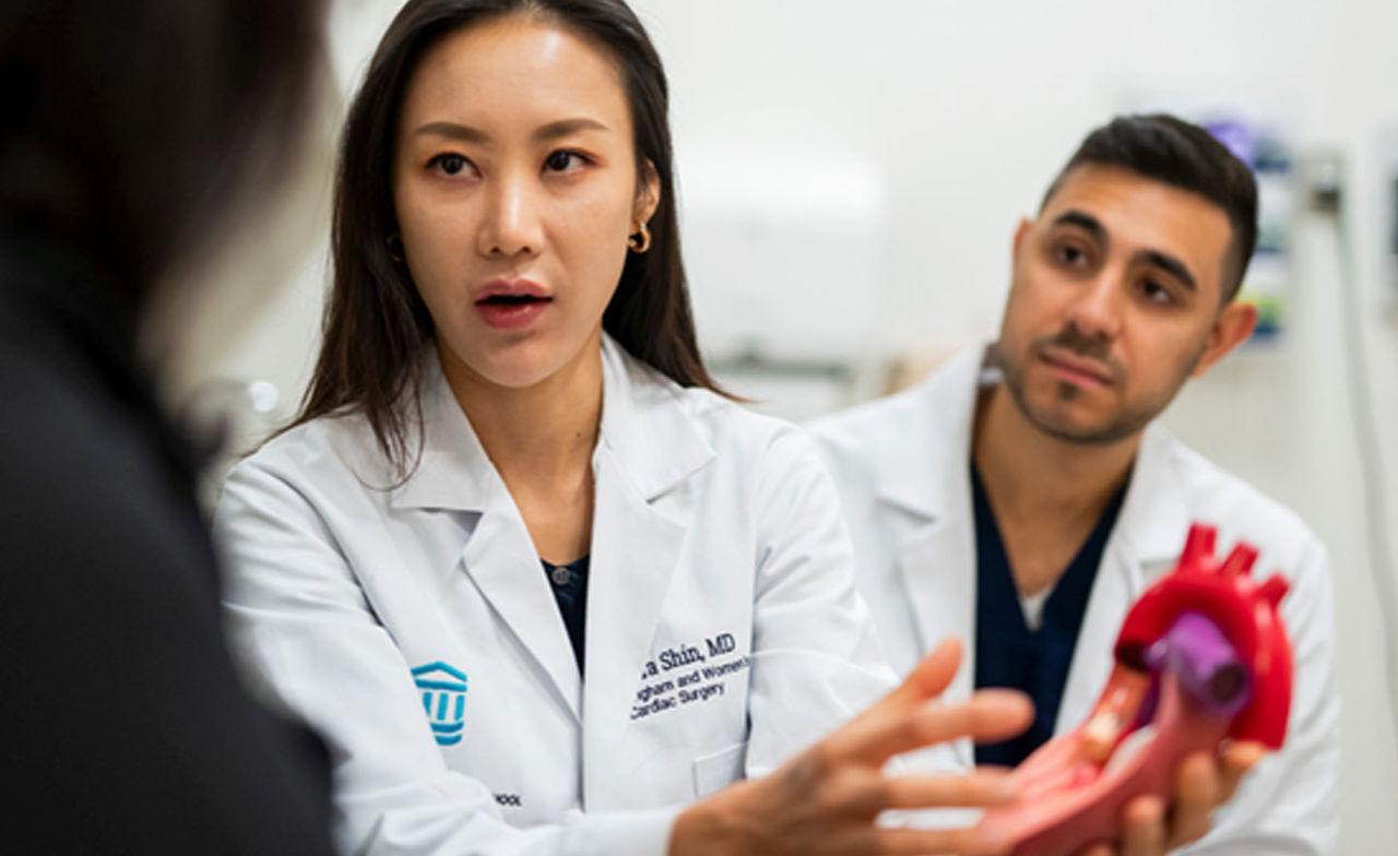 Dr. Shin holding a model of the heart