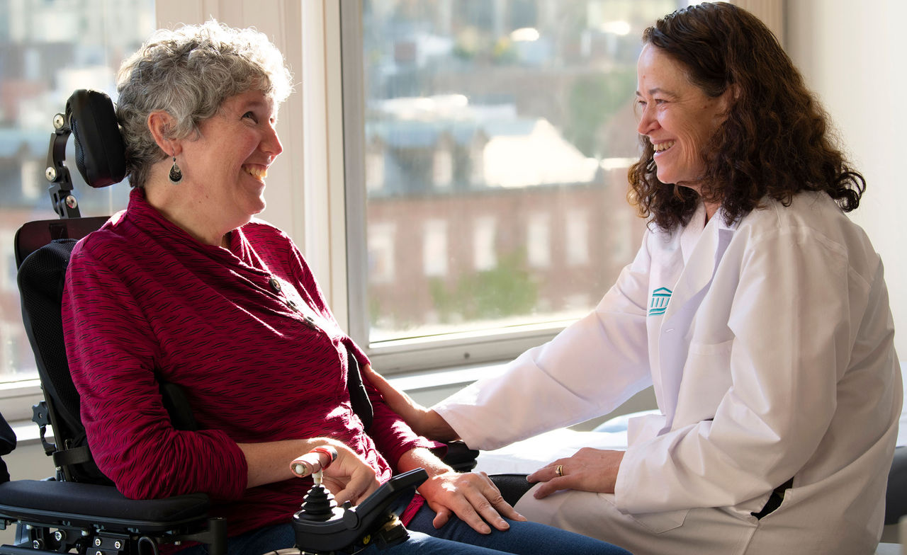 Merit Cudkowicz, MD, MSC with patient