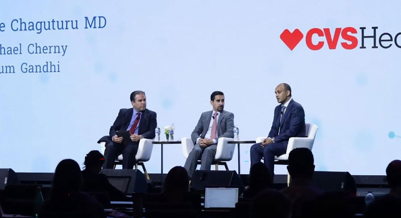 Sree Chaguturu, Michael Cherny, and Niyum Gandhi discuss on stage