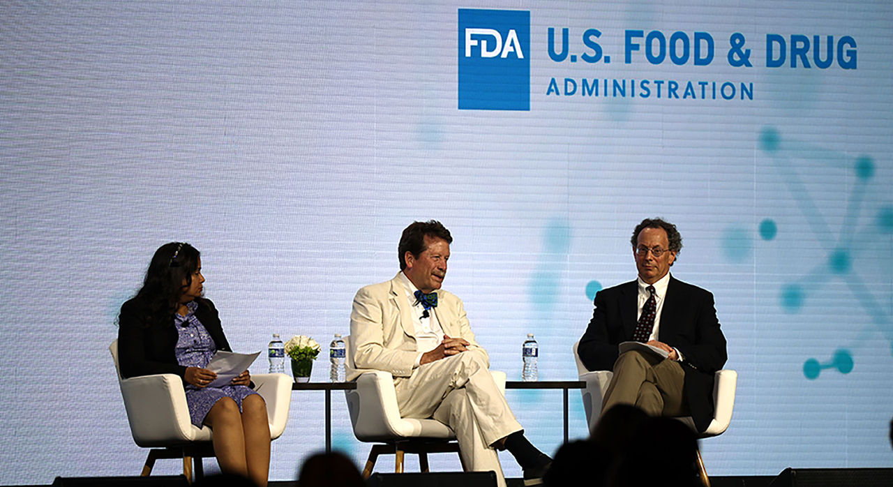 Robert Califf discusses with fellow panelists