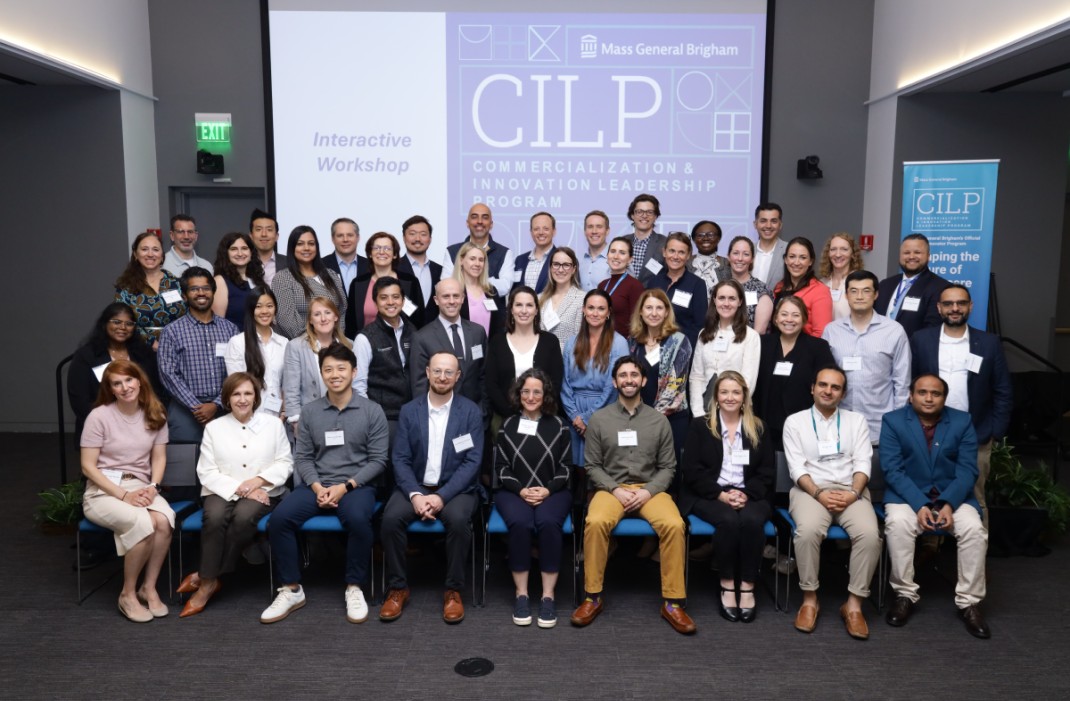 Group photo in front a projector that reads "CLIP?