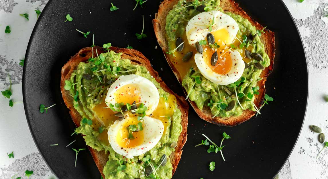 Poached eggs on avocado toast.