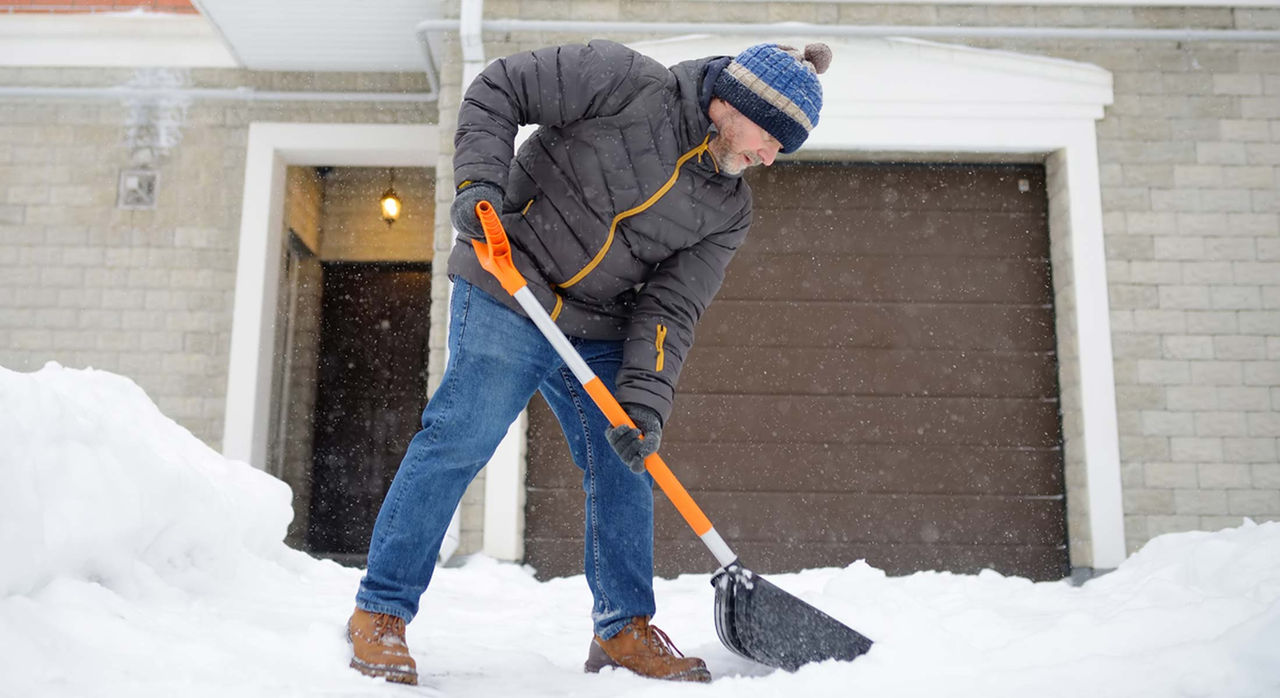 Man shovels snow