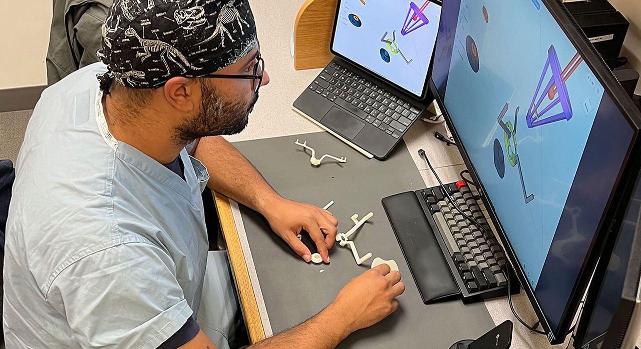 Dr. Walid Ibn Essayed observes a 3D model on the computer screen