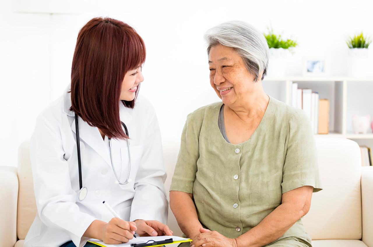 A doctor and patient engage in discussion.