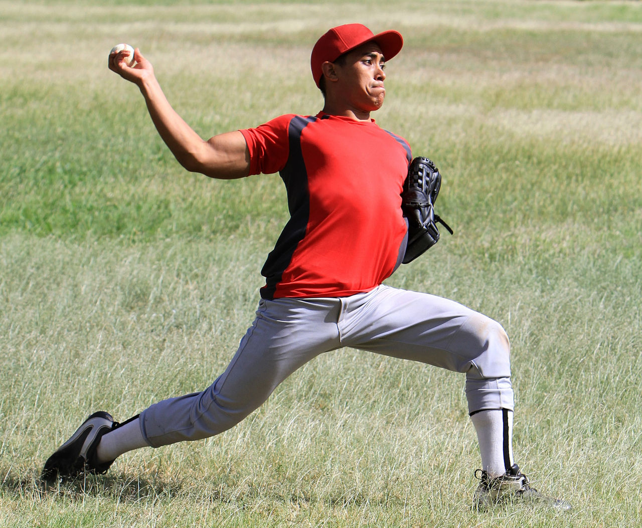 A baseball pitcher throws a ball.