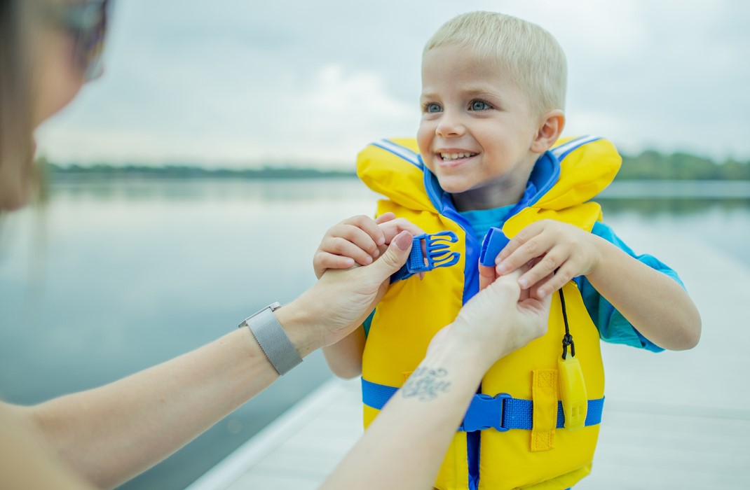 Child in life jacket to prevent drowning