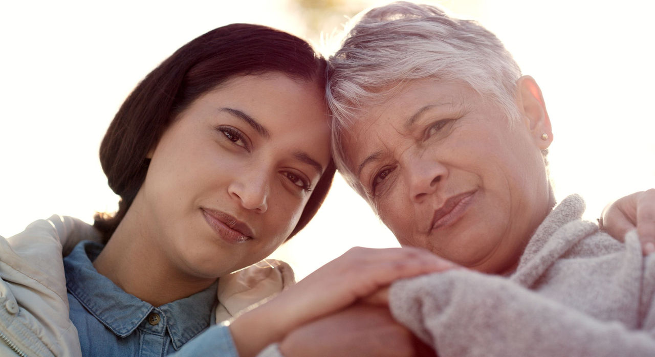 Mother and daughter embracing