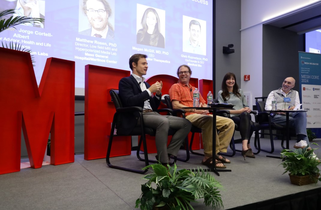 people on a MESH panel speaking on stage