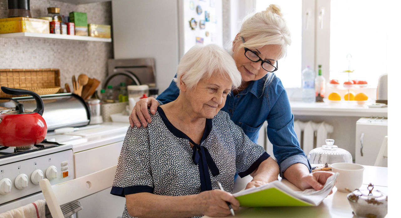 An adult woman speaking with her mother about their family health history