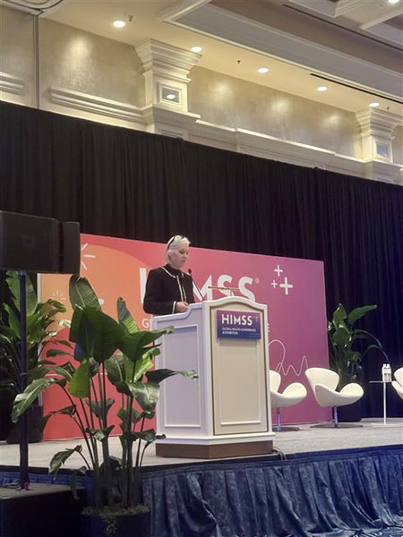 Jane Moran speaks at a podium at the 2026 HIMSS Global Conference & Exhibition.