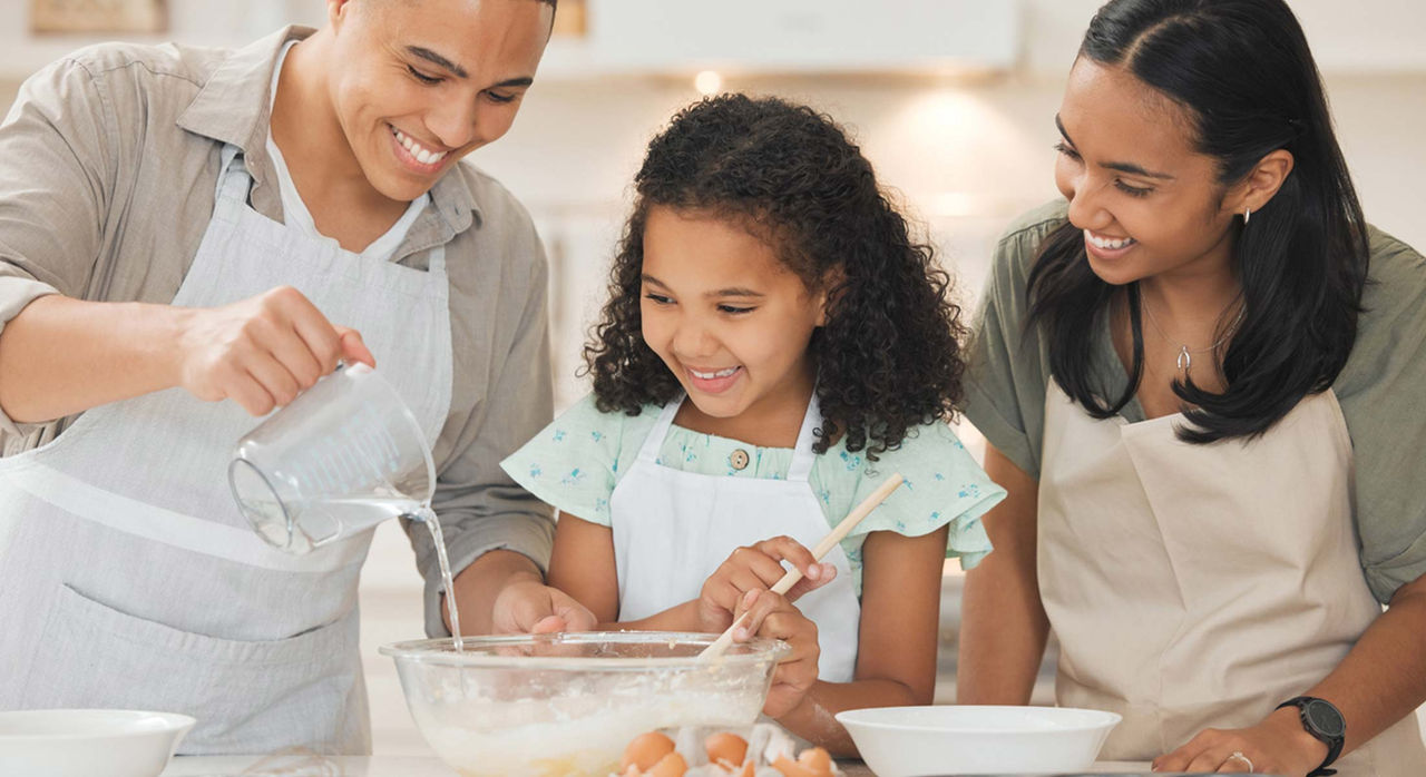 Family baking with raw cookie dough