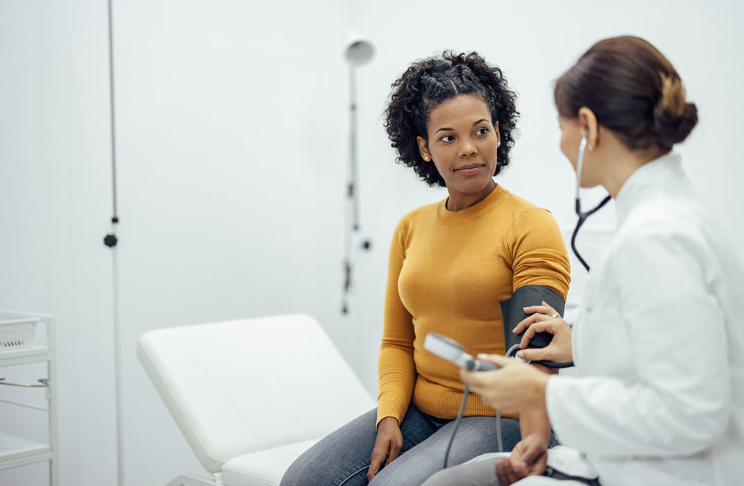 A doctor speaks with a patient
