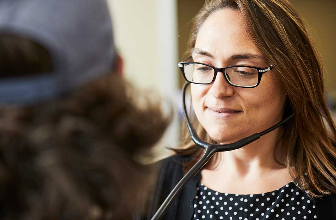 A female doctor wearing a stethoscope.