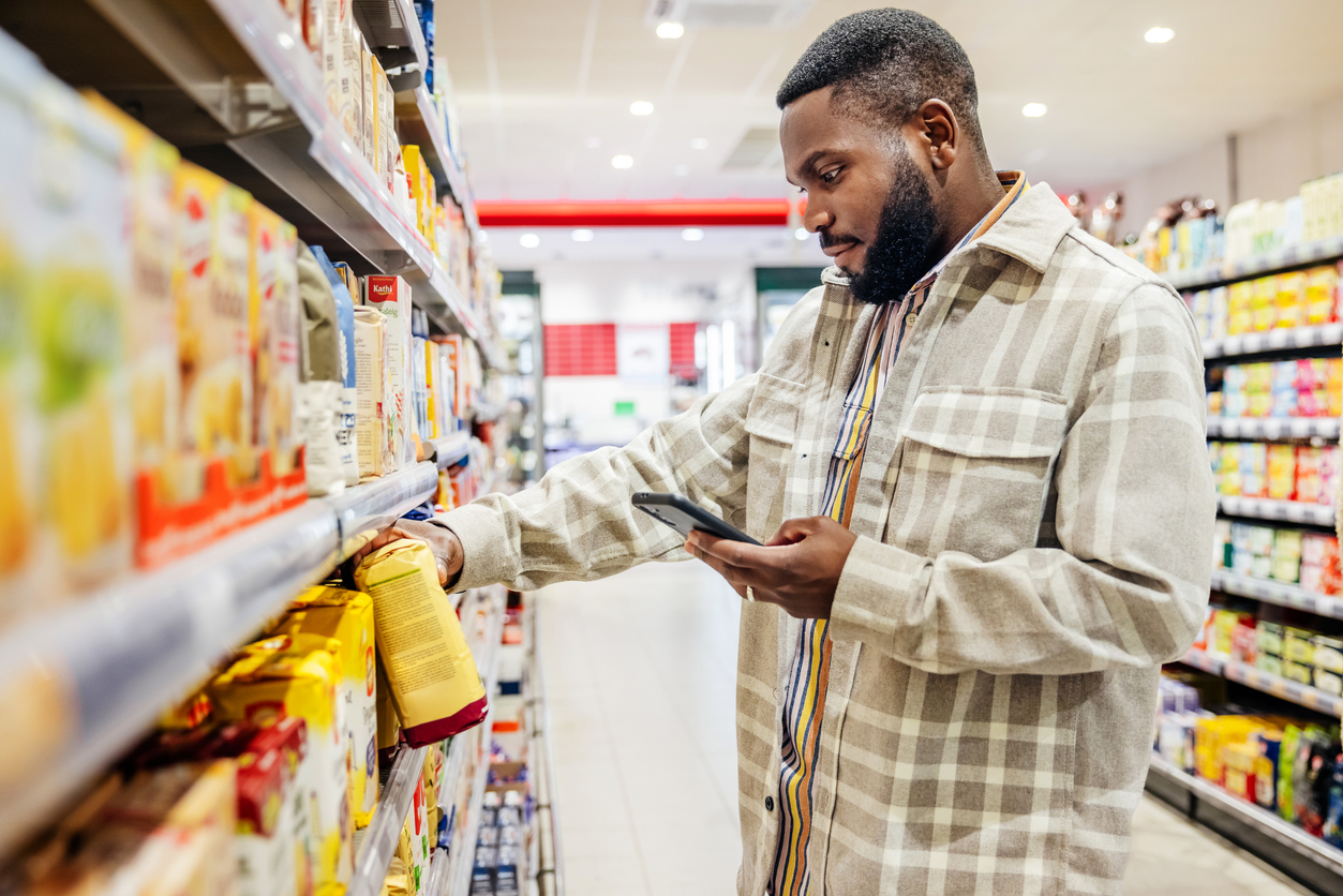 Man checks food label at grocery store