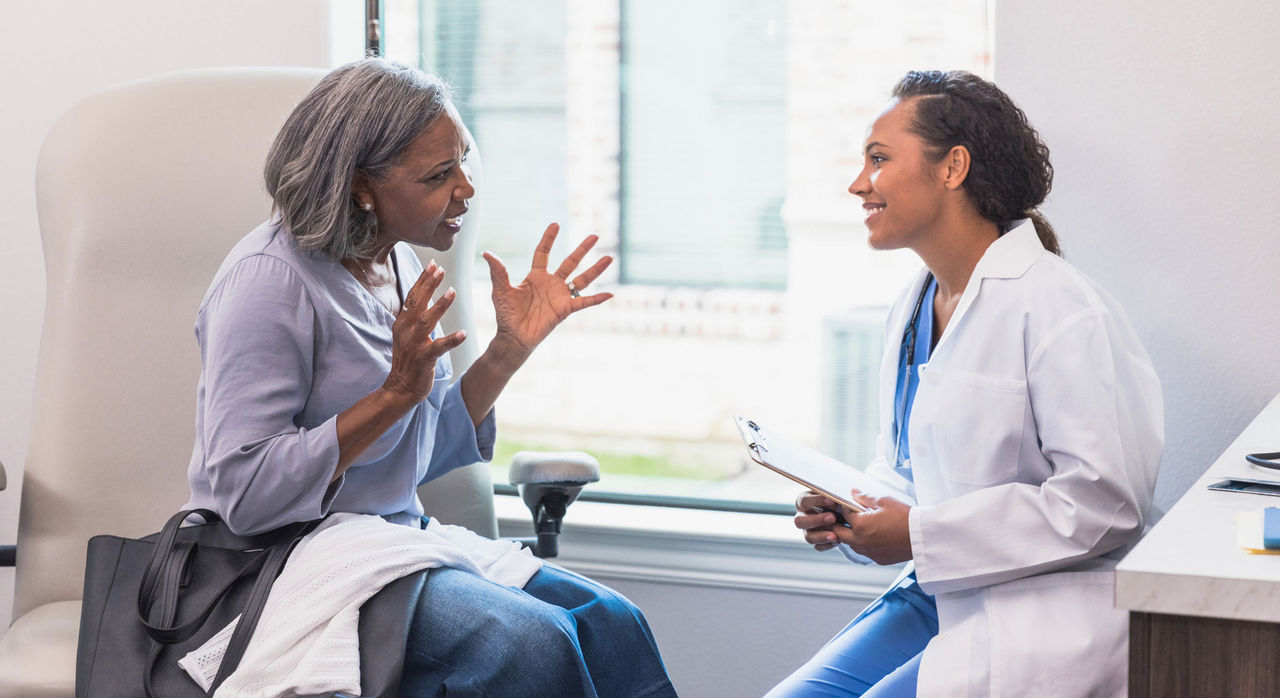 Patient and doctor discuss breast cancer screening