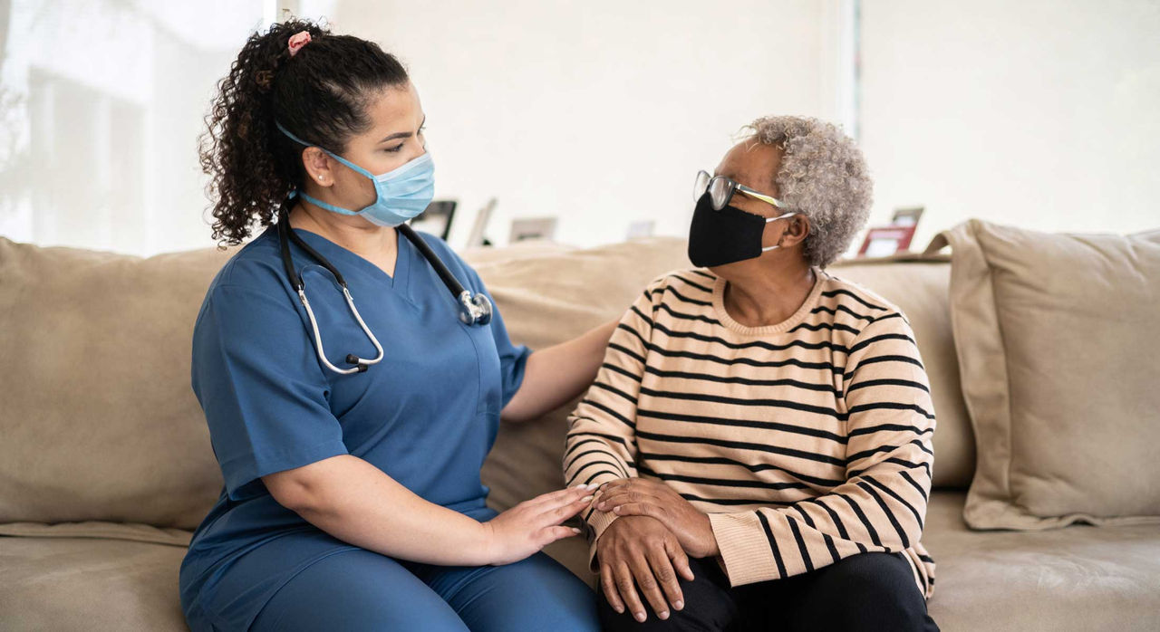 A provider meets with a senior patient