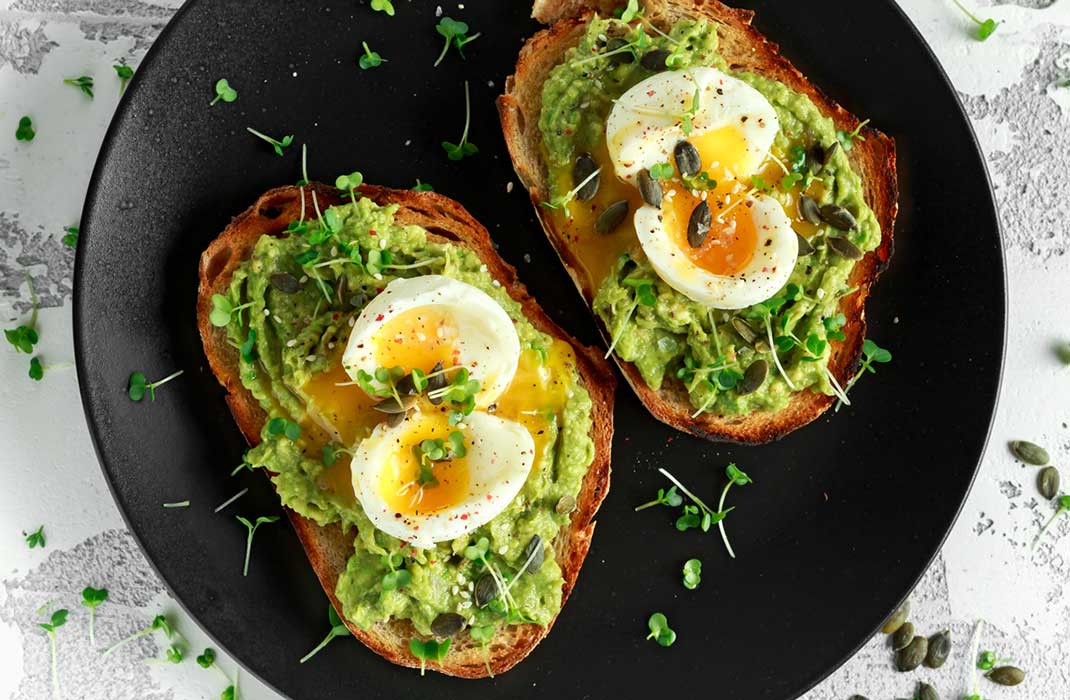 Poached eggs on avocado toast.