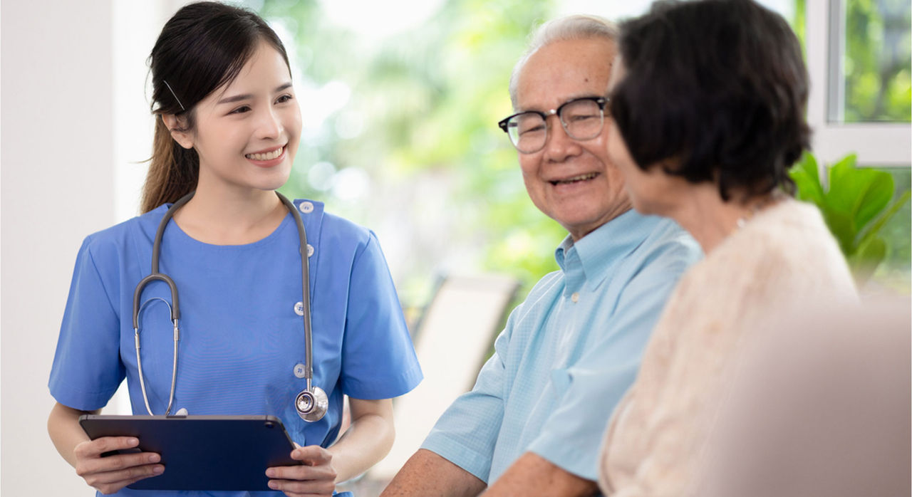 Patient and caregiver talking to health care provider about living with epilepsy.