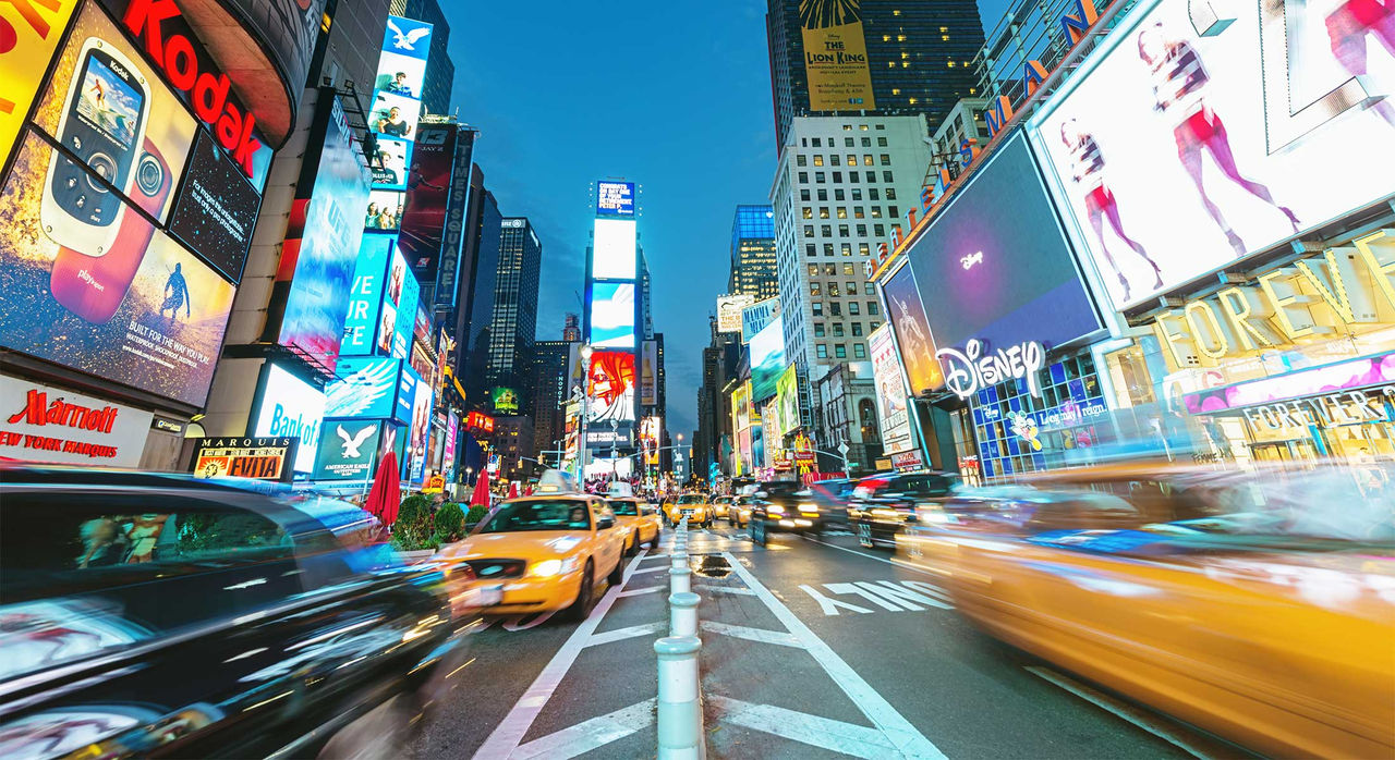 Taxis whizzing through Times Square