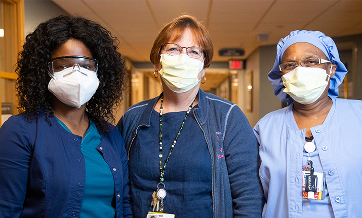 3 female health professionals in masks