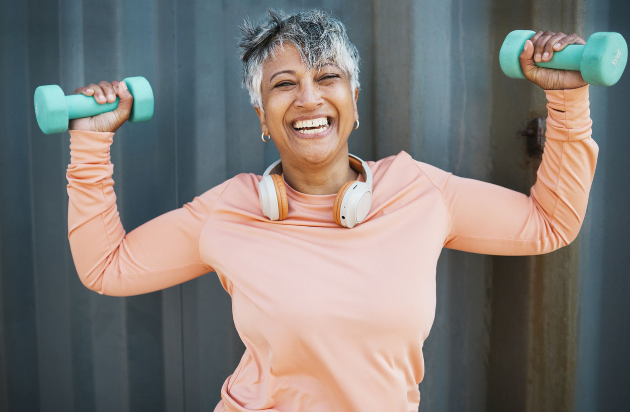 A woman uses free weights and exercises for osteoporosis management.