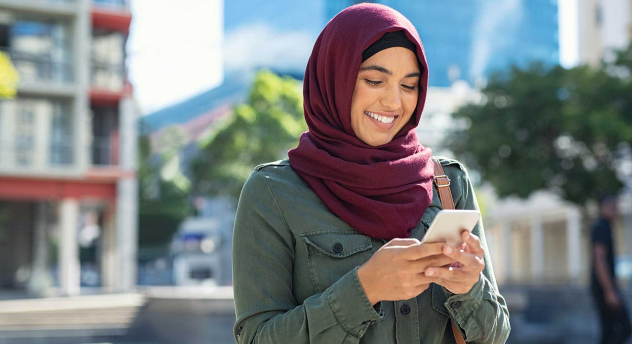 Young woman using a mental health app on her phone.