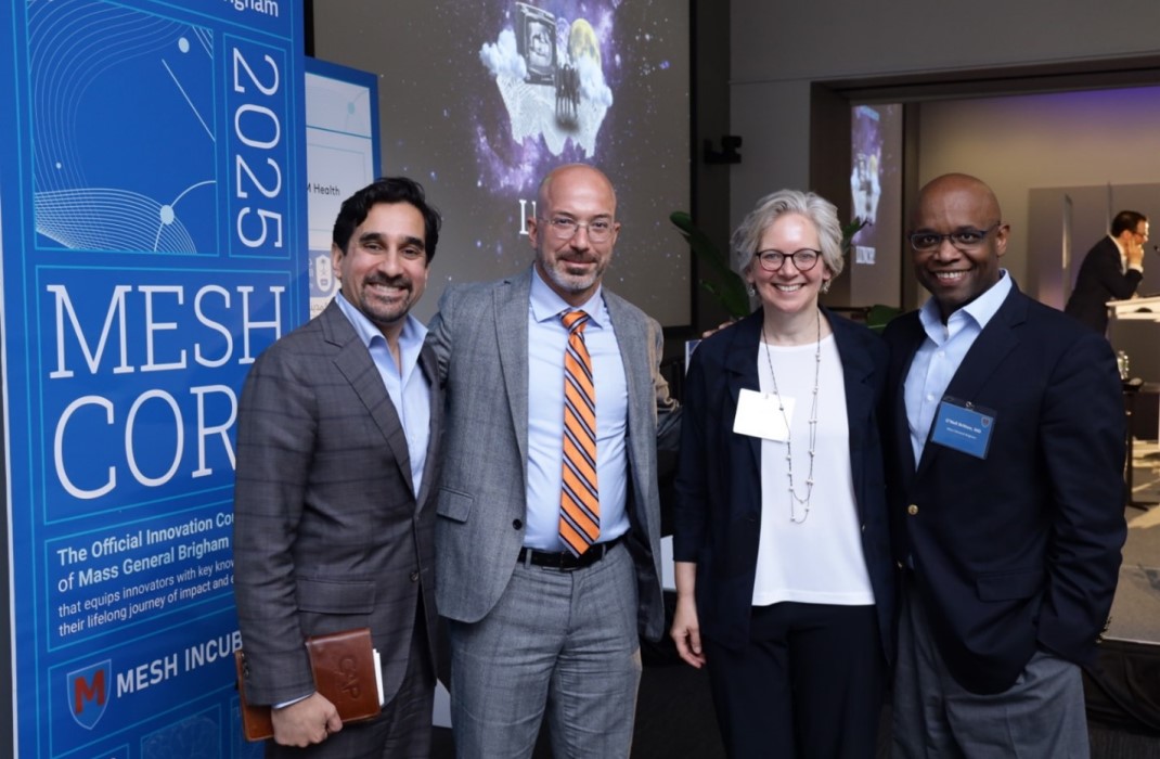 Four people in front of a sign that says MESH CORE 2025