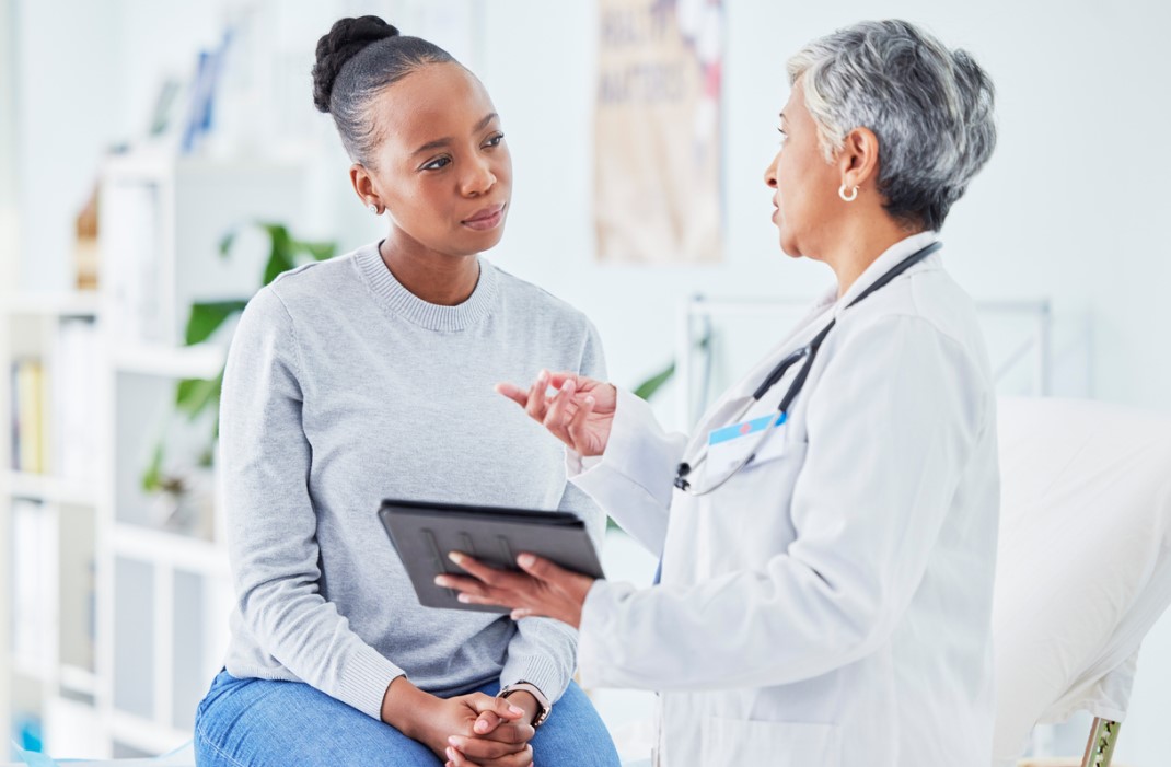 Woman cancer patient with doctor