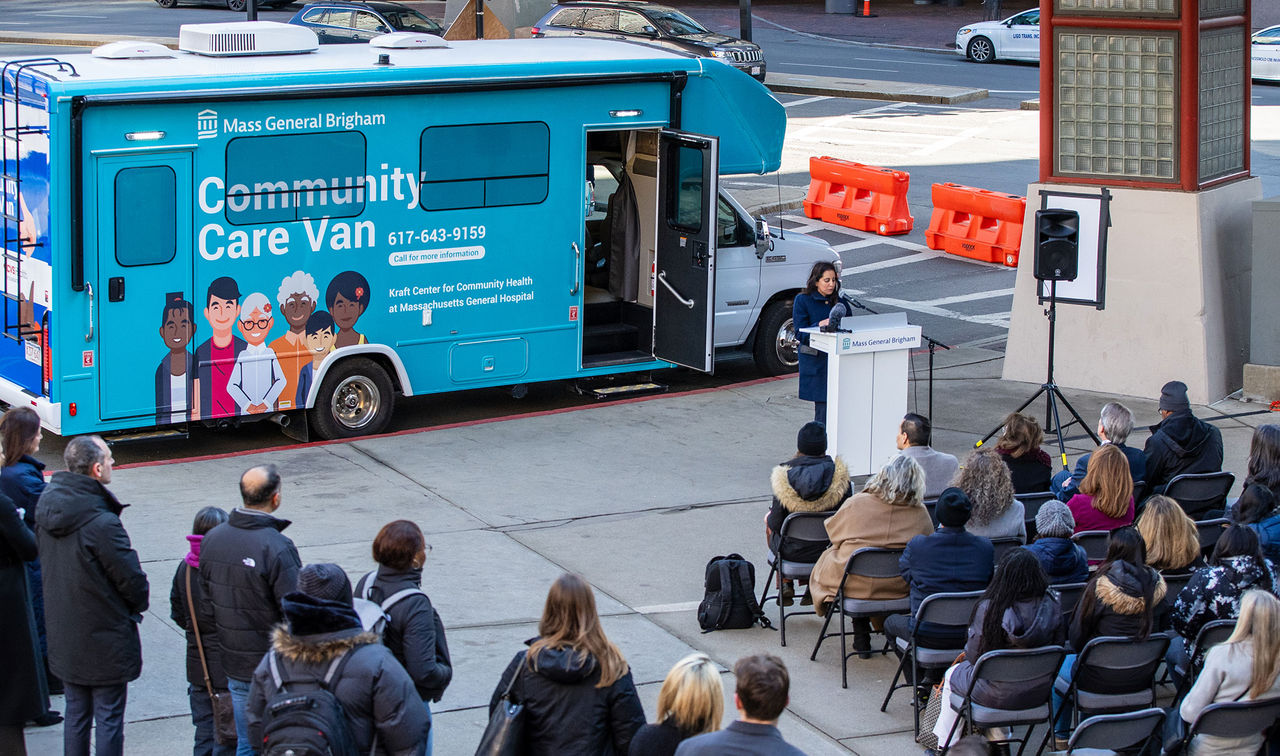 Priya Sarin Gupta, MD, MPH, speaks to community members about the newly redesigned Mass General Brigham community care vans.